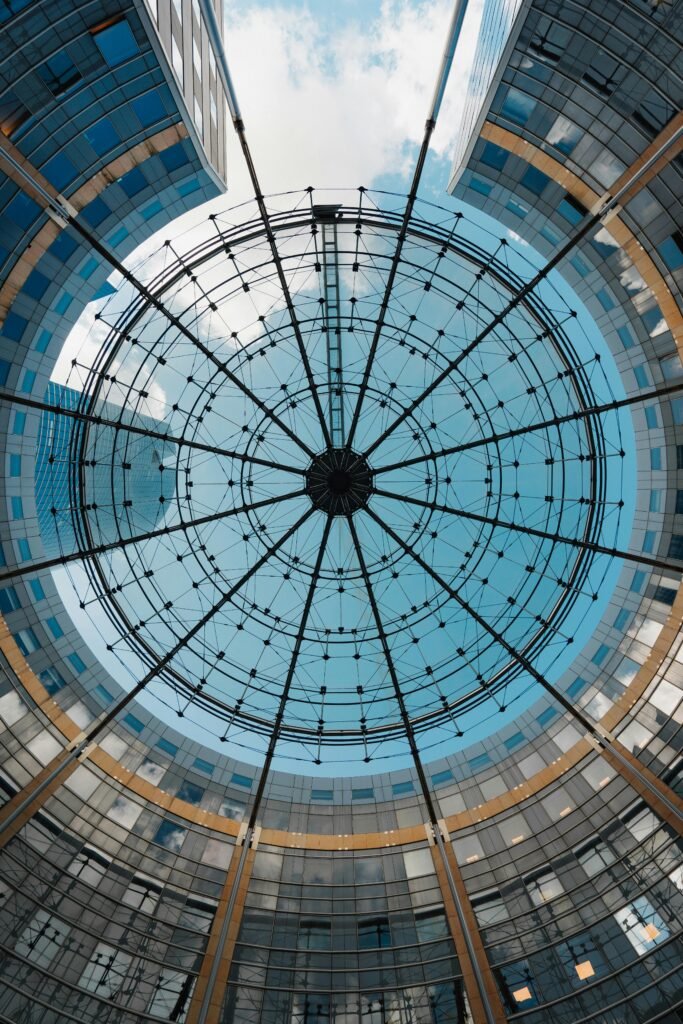 Stunning glass ceiling with modern architectural pattern captured from below.